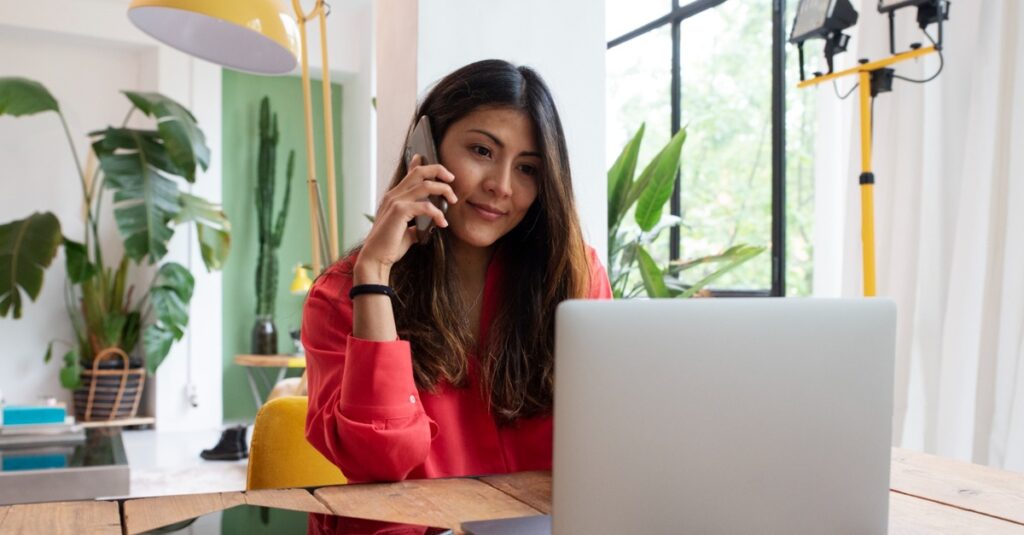 Remote professional from Latin America working on a laptop during U.S. business hours, representing reliable nearshore staffing for U.S. companies.